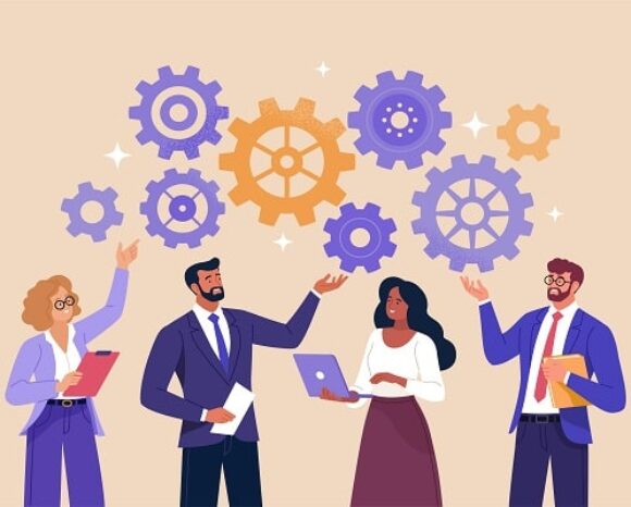 Vier Geschäftsleute stehen da und interagieren mit großen, schwebenden Zahnrädern. Sie tragen Geschäftskleidung und scheinen zusammenzuarbeiten. Zwei halten Laptops, einer Dokumente. Die Zahnräder symbolisieren Teamarbeit und Problemlösung.